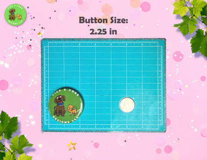 2.25 in button pin placed on a cutting mat with quarter for scale