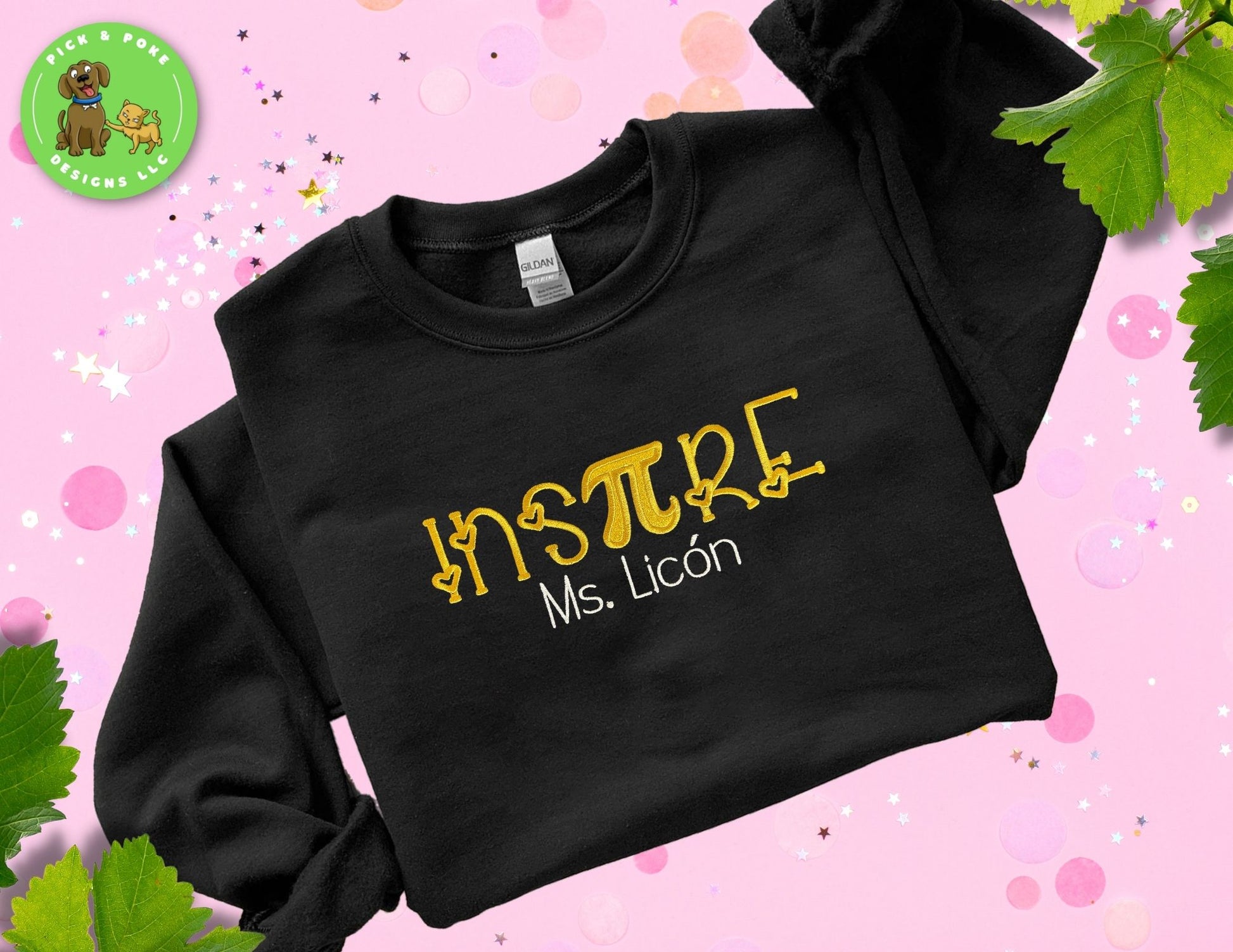 Black crewneck sweatshirt embroidered with the phrase “inspire” stylized with a PI mathematics sign and teacher name
