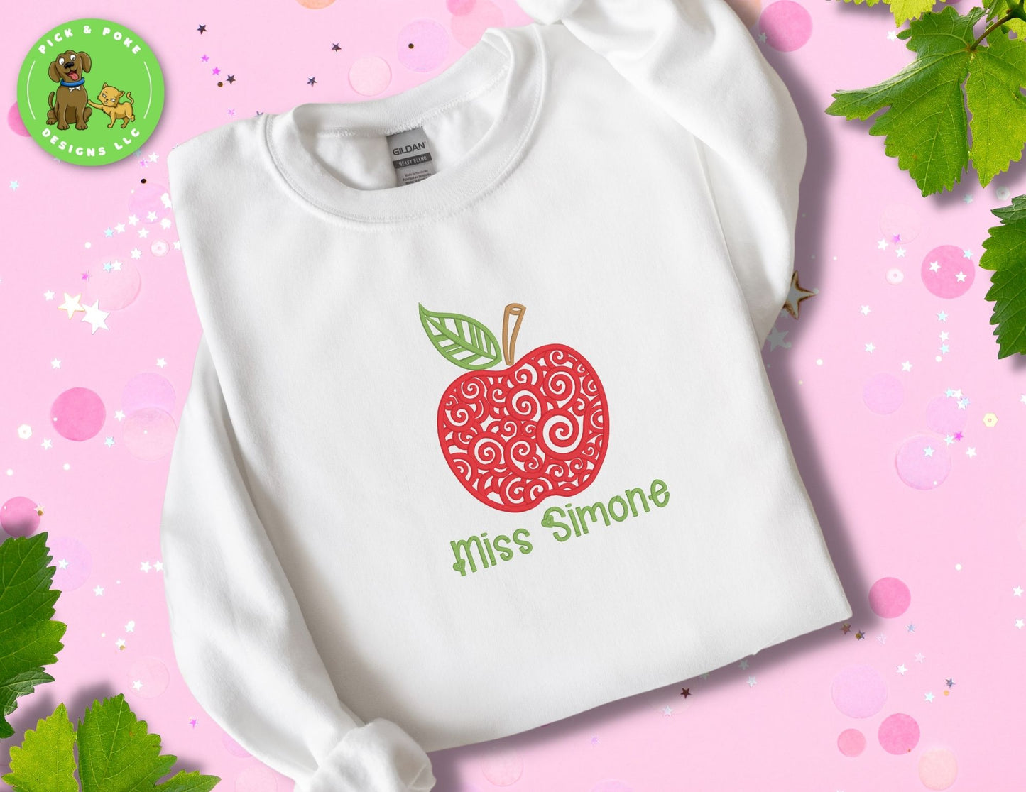 White Gildan crewneck style crewneck with embroidered swirl apple design and teacher name under the apple.