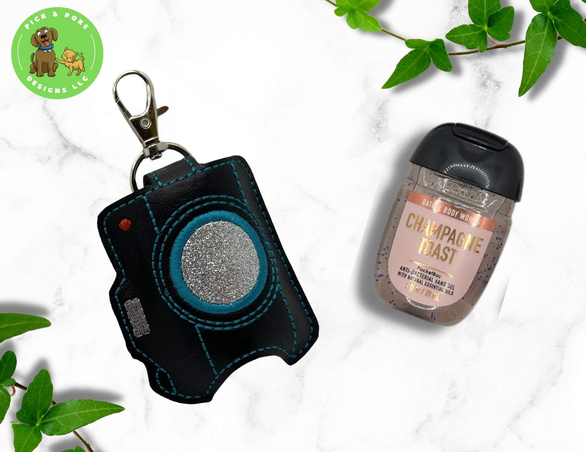 Retro camera hand sanitizer keychain is made from black sewing vinyl and glitter vinyl canvas